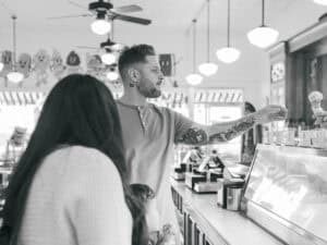 dad grabbing ice cream from waiter