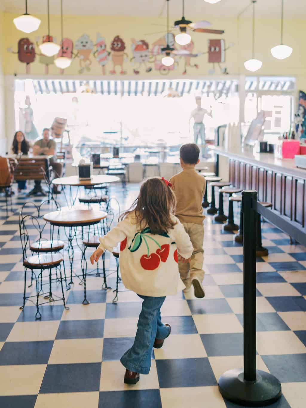 kids running in ice cream parlor