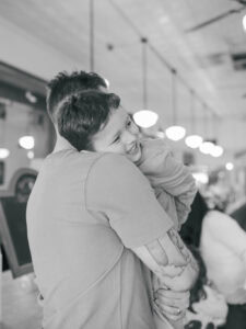son on dad's shoulder