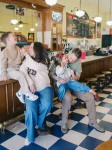 family at a maternity photoshoot after having ice cream