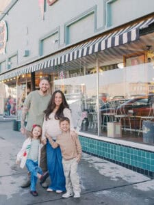 family outside local ice cream parlor