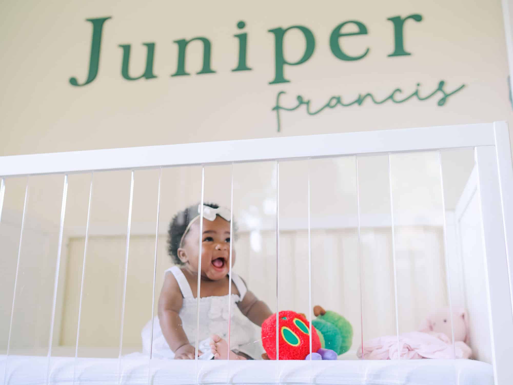 baby in crib smiling